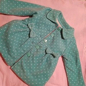 Mint green coat with white polka dots